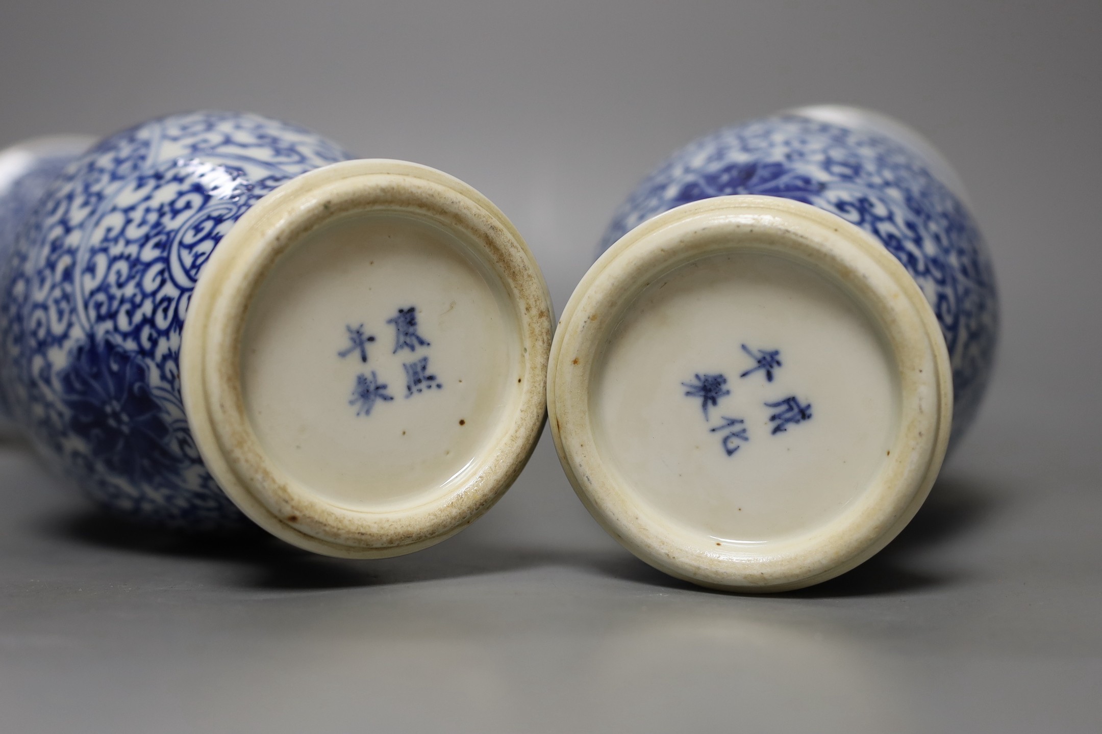 A pair of Chinese blue and white vases, 19th century, 28cm high.